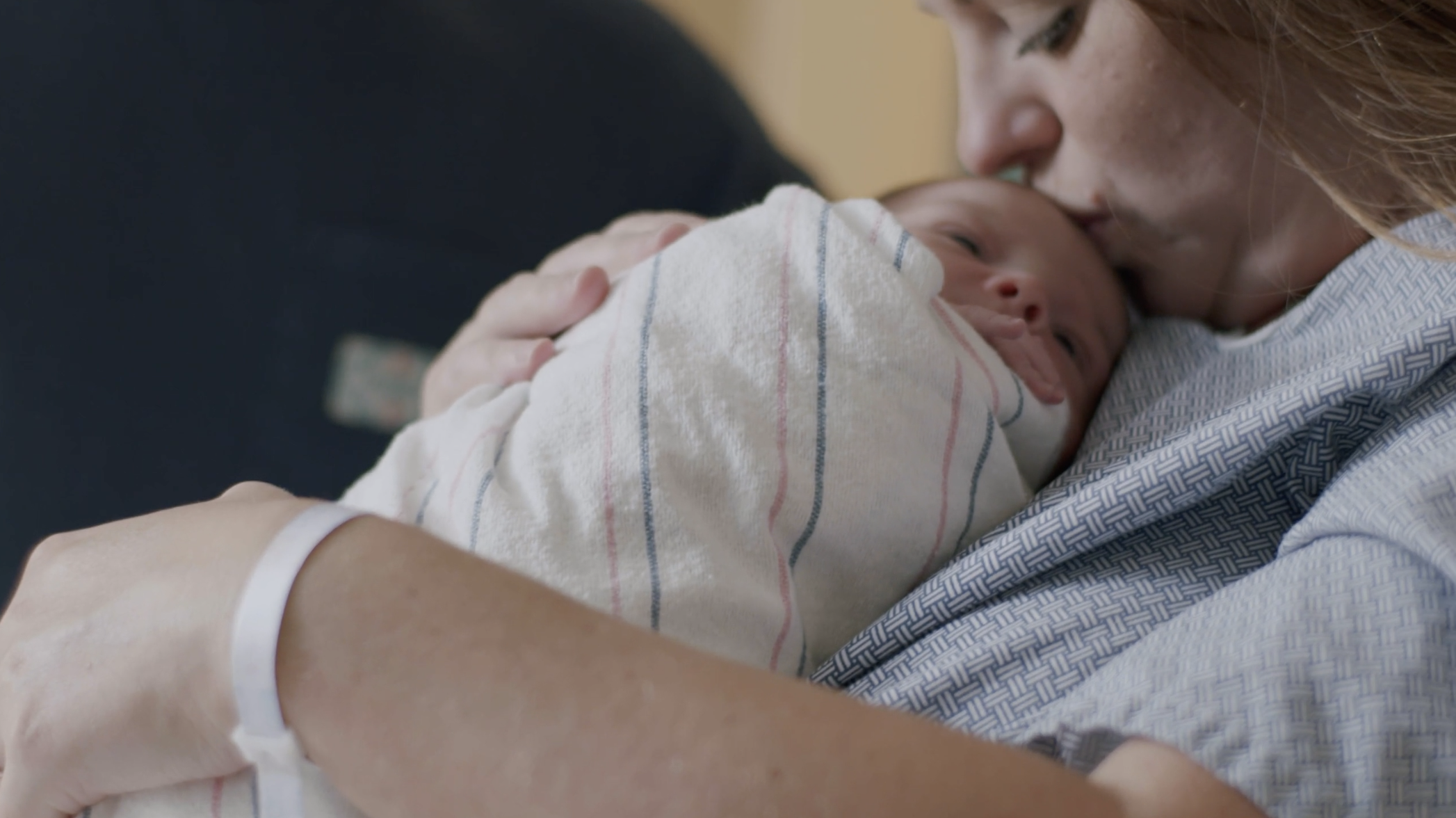 Mother resting with her newborn baby