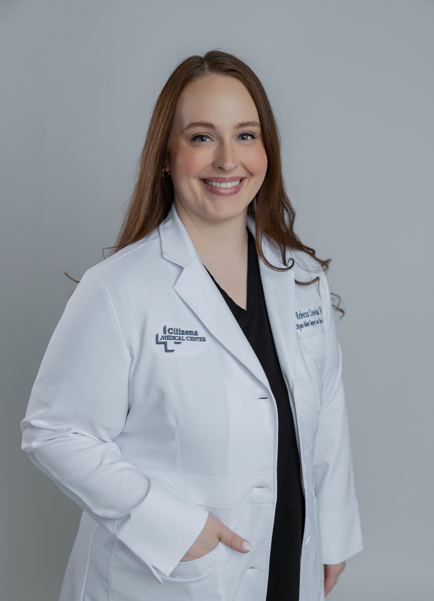 Rebecca Copeland, MPAS, PA-C, in a white coat