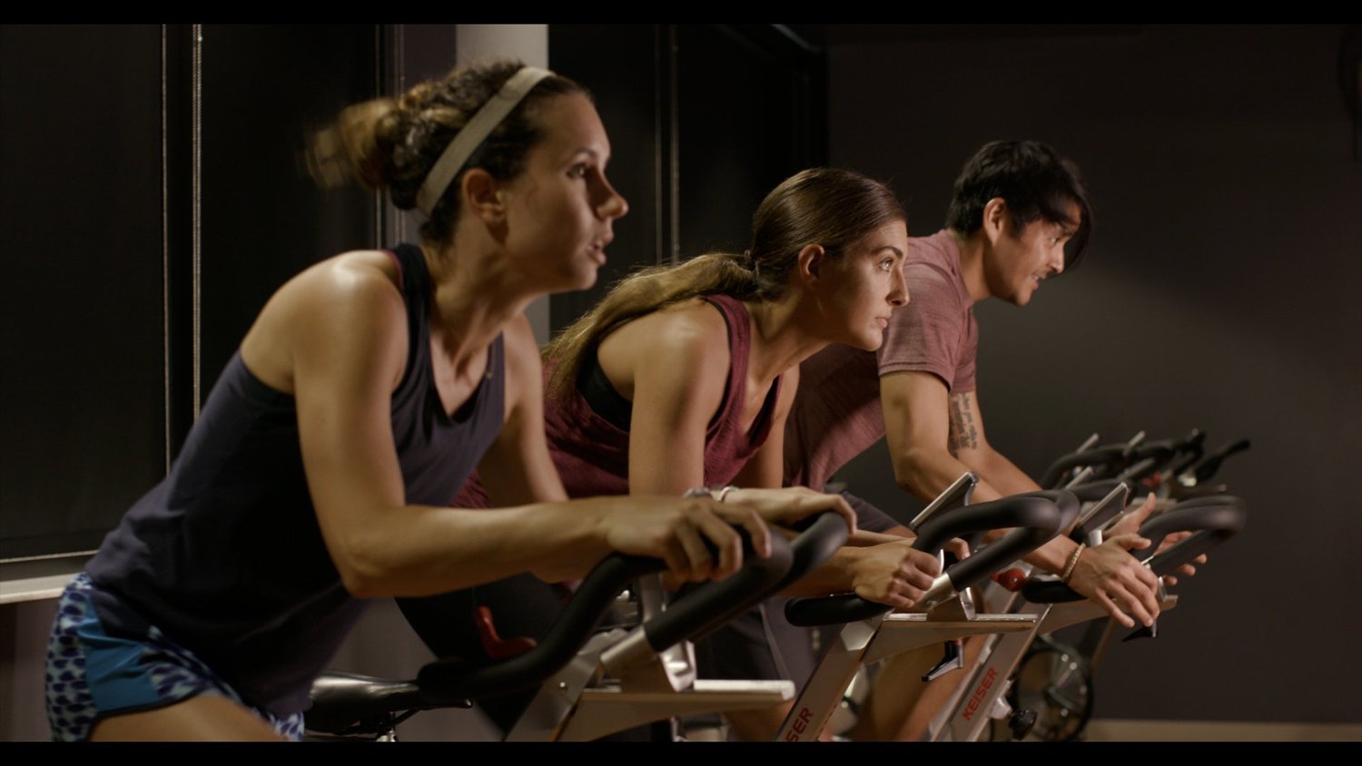 People participating in a group cycling class at Citizens HealthPlex
