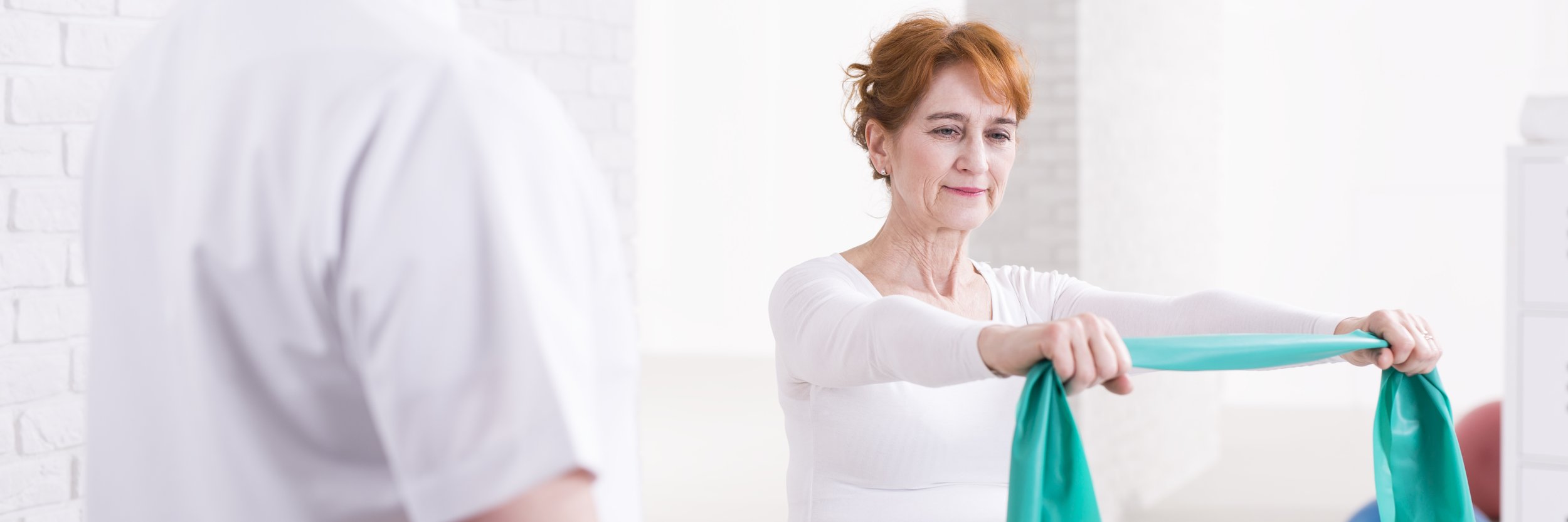 Patient using a resistance band during physical therapy