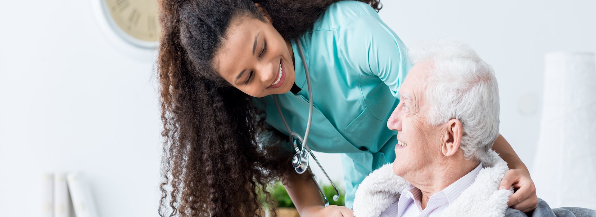 Nurse speaking with an older patient